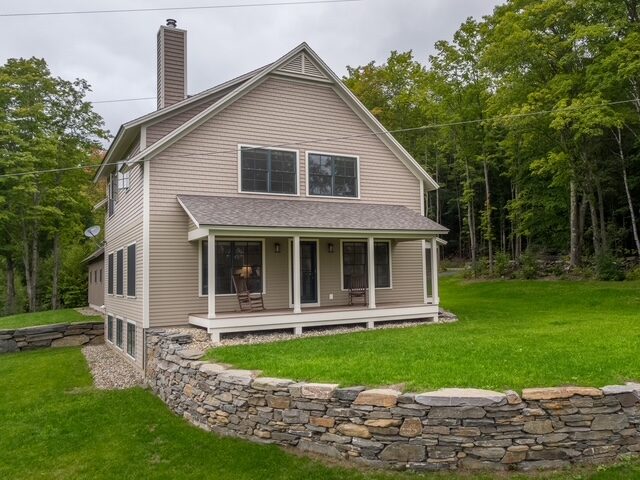 Dry-laid stone retaining wall by Tancreti Stone Masonry